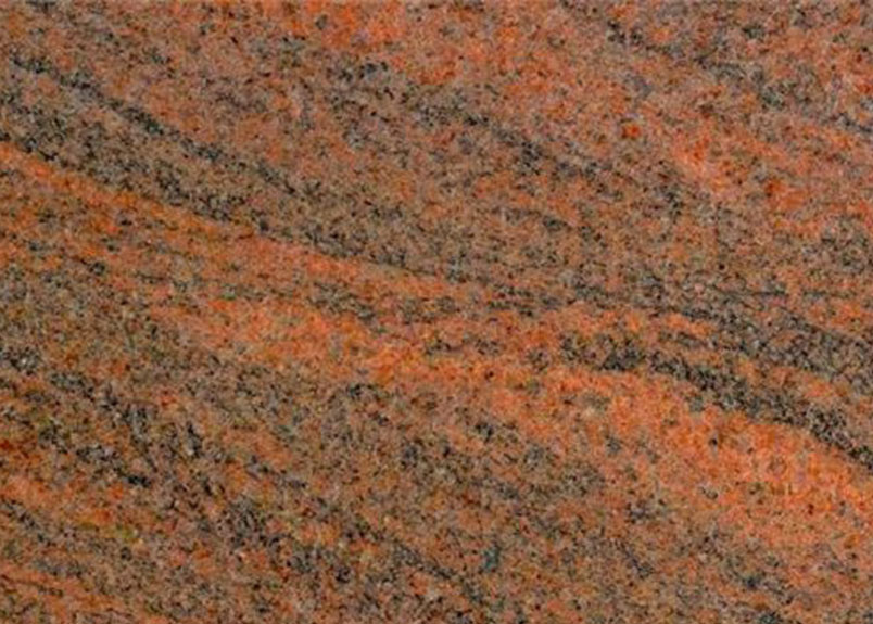 leuchtend orange-roter Granit mit schwarzer Maserung